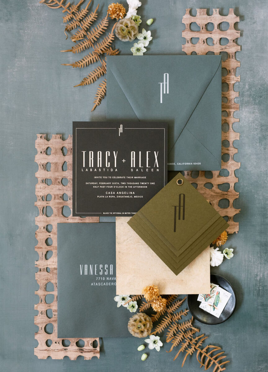 A modern bohemian wedding invitation suite in shades that match their Mexican wedding venue: sand, earthy green, black, and a sea blue.